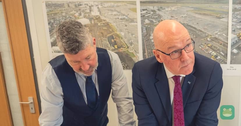 Then-chief executive Gordon Dewar and First Minister John Swinney review the plans at the South East Pier site.