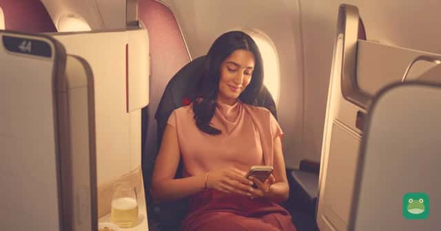 An Air Canada passenger using her phone in a premium cabin. Photo: Air Canada
