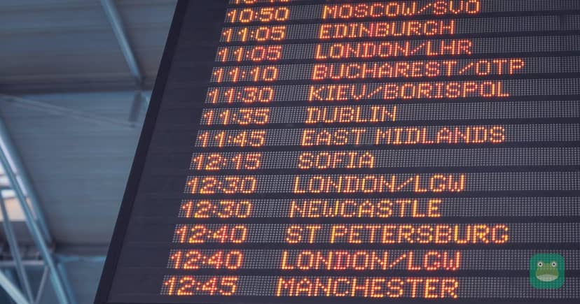 A departure board inside an airport terminal
