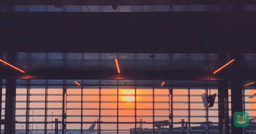 Low sun through the windows of an empty airport concourse