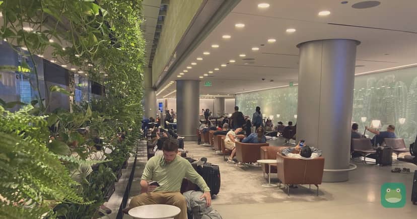 Al Maha Lounge, DOH — main seating area with green wall