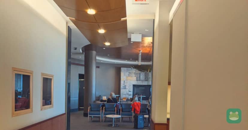 Delta Sky Club, MSP Concourse C — high-tops and fireplace seating