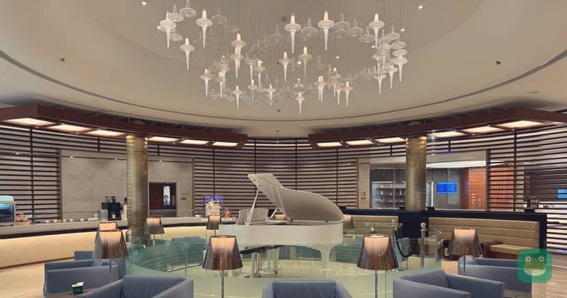 Saudia AlFursan Lounge, JED Terminal 1 — main hall with piano and seating