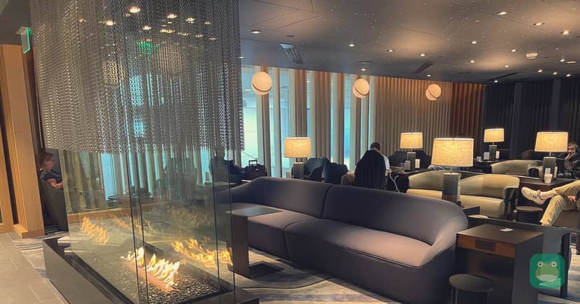 American Airlines Admirals Club, DEN Concourse C — fireplace seating area