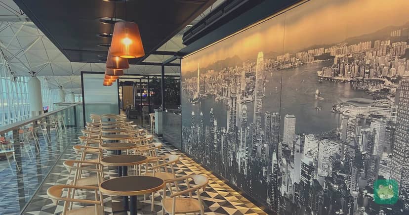 Qantas Hong Kong Lounge, HKG Terminal 1 — cafe-style seating overlooking the terminal
