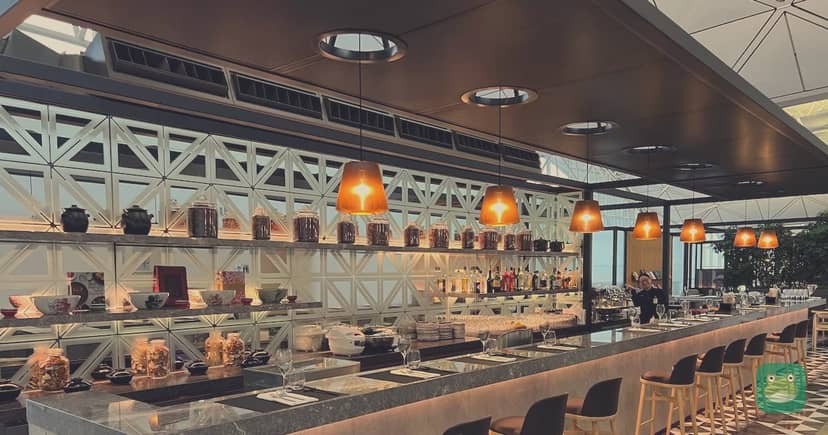 Qantas Hong Kong Lounge, HKG Terminal 1 — bar seating with high-top tables
