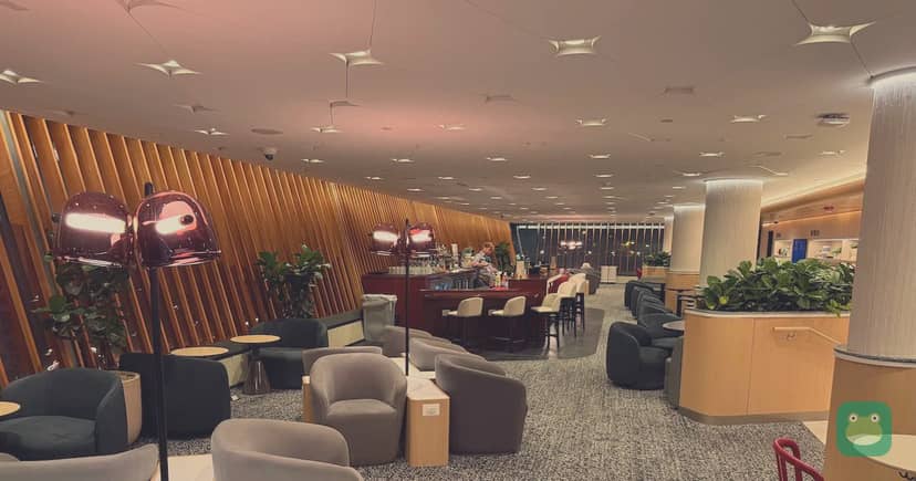Capital One Lounge, IAD Main Terminal — main seating around the central bar