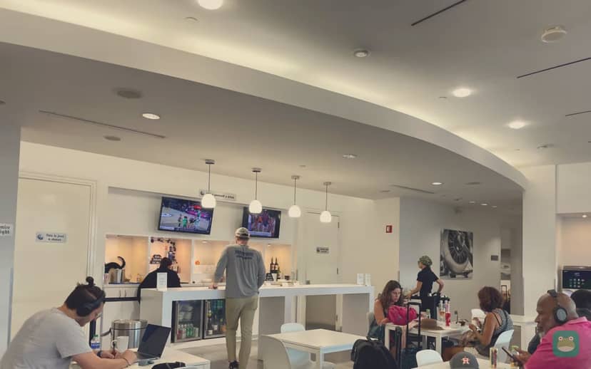 The Lounge San Juan at Terminal C, SJU Terminal C — cafe seating with the bar behind