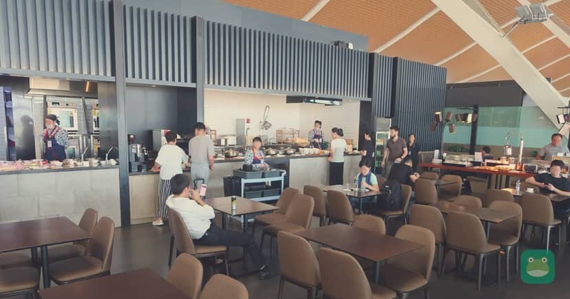 China Eastern Airlines No. 77 Lounge, PVG Terminal 2 — dining area and food counters